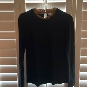 JCrew sweater with animal print ruffle at neck